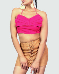Bow Crop Top With large pink Bow on the front worn by a model with a ashort skirt