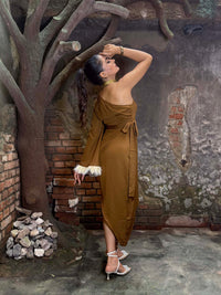 Model wearing one shoulder dress with Fur